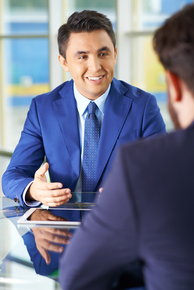 businessmen using a touchpad in a meeting О нас Yuudos